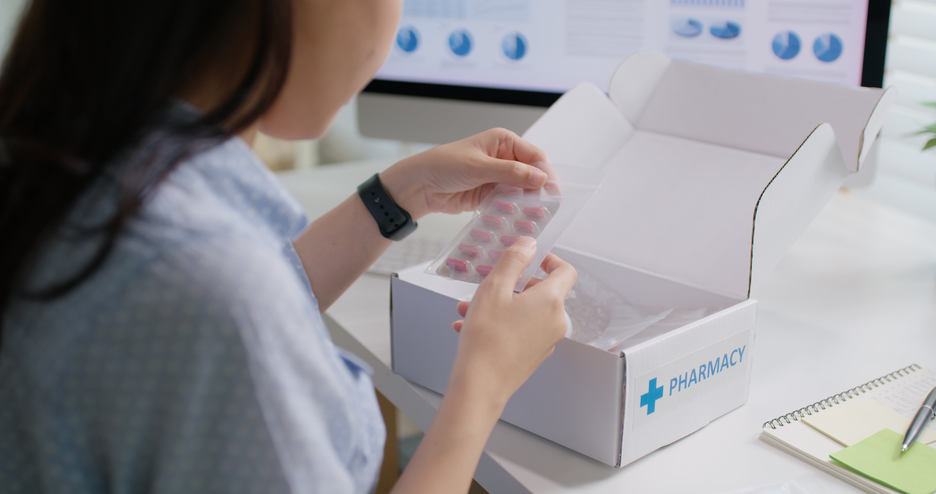 Woman checking her pharmacy delivery order