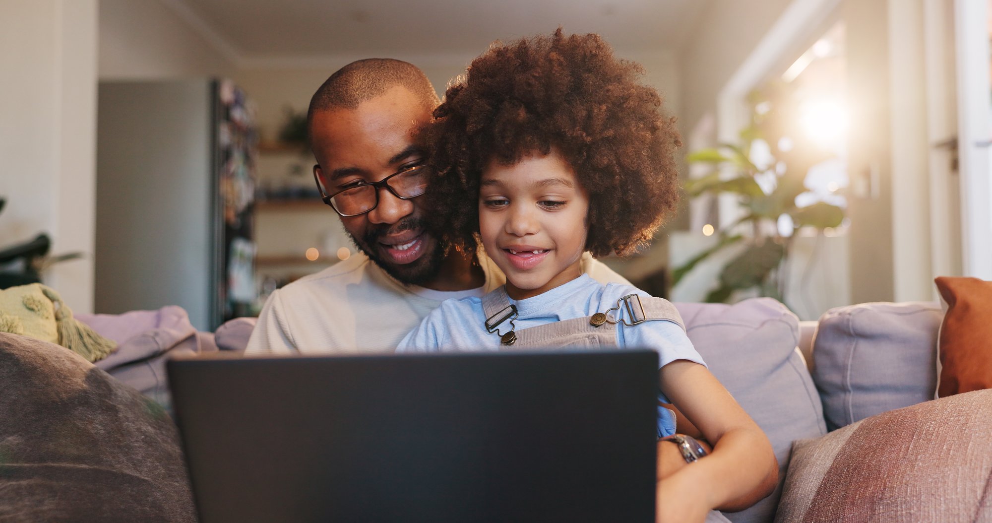 man and child on a laptop man and child on a laptop