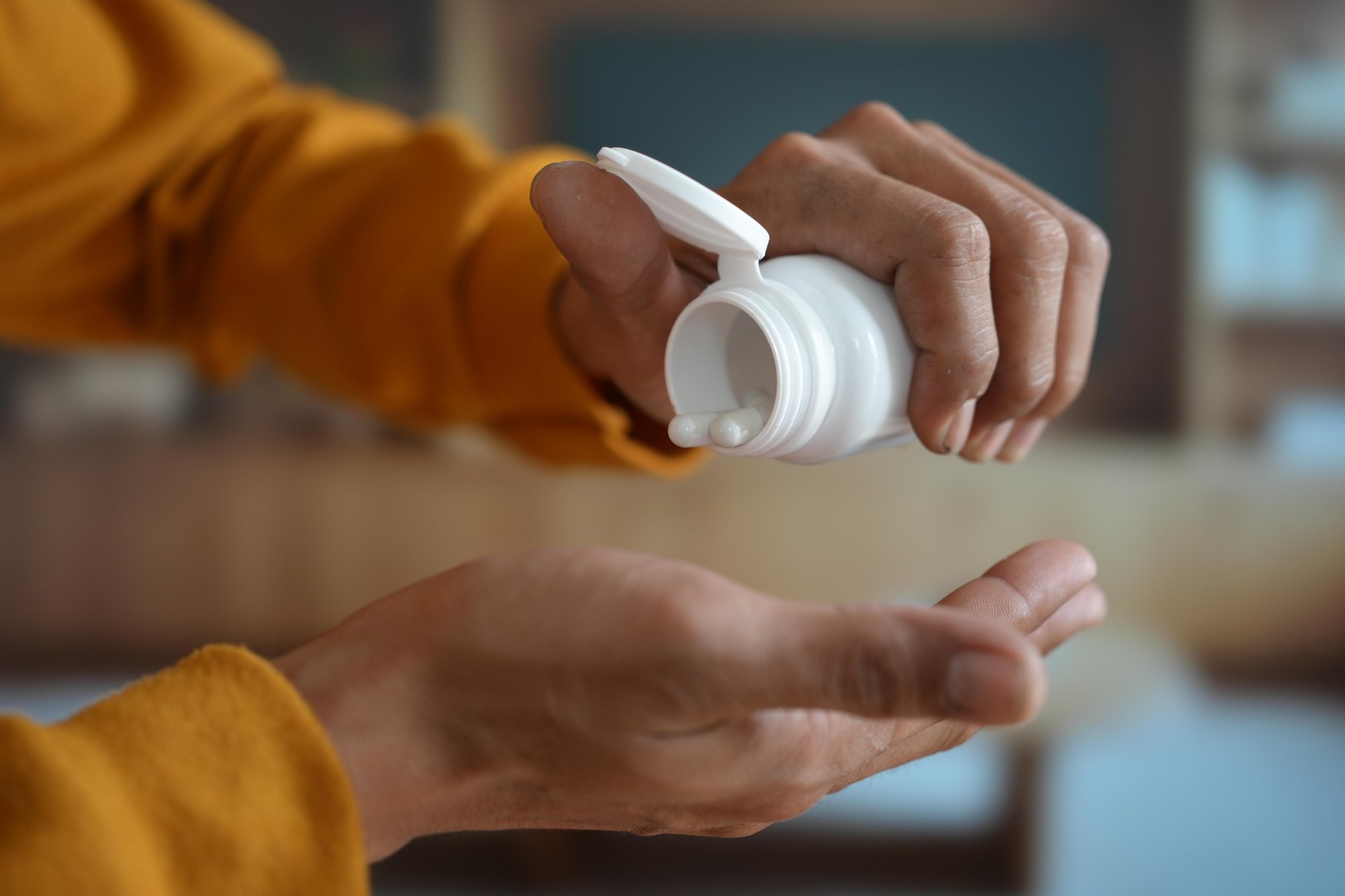 Man taking prescription pills Man taking prescription pills